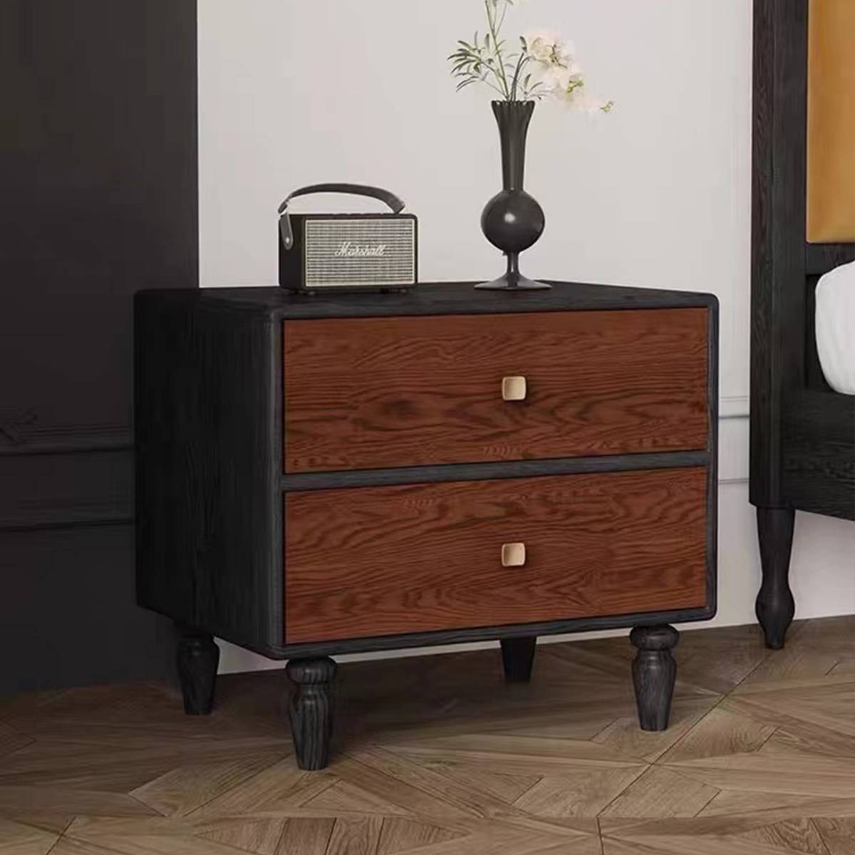 Bedside table styled with a Marshall speaker and vase
