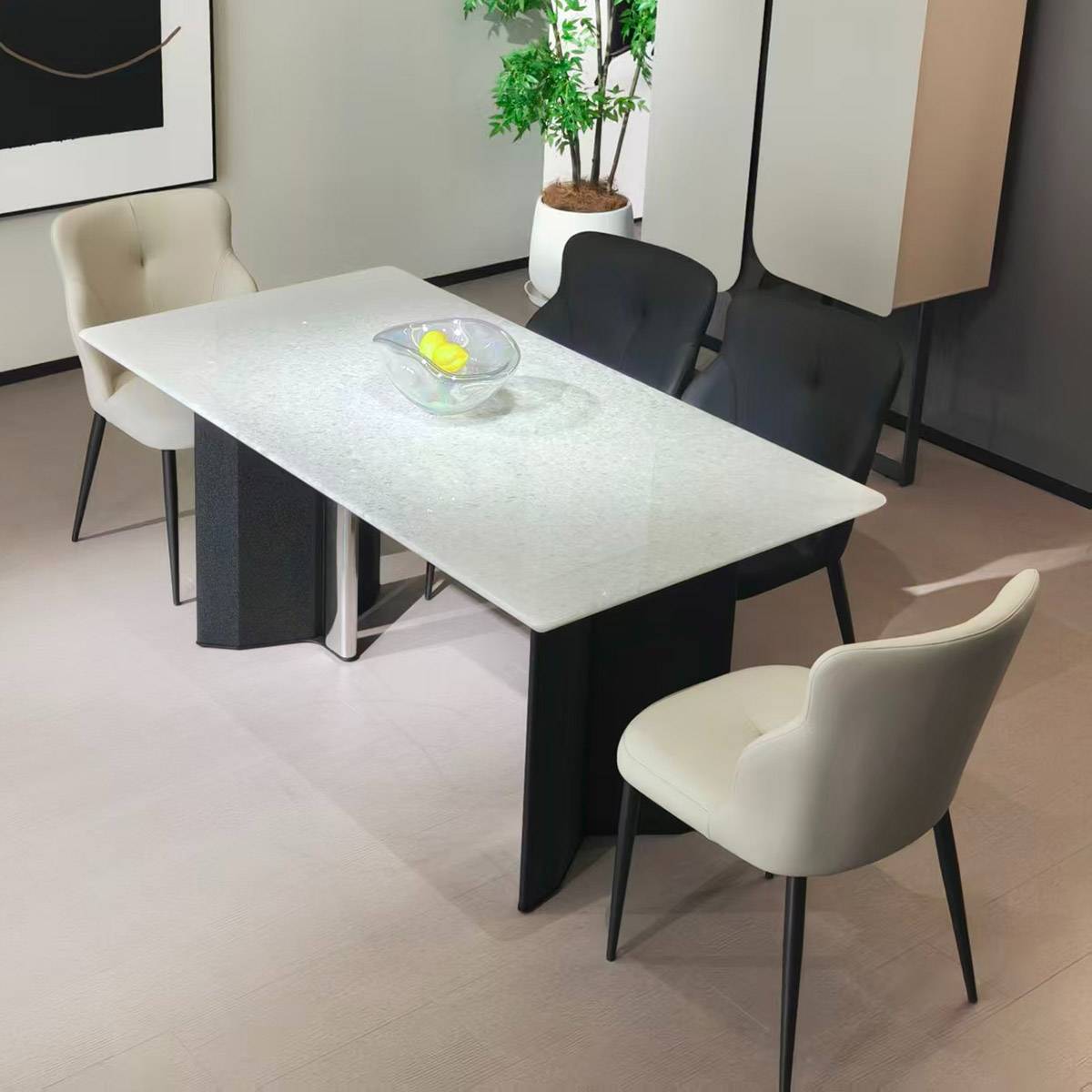 Brazilian Ice Diamond natural stone dining table with black steel legs and white chairs