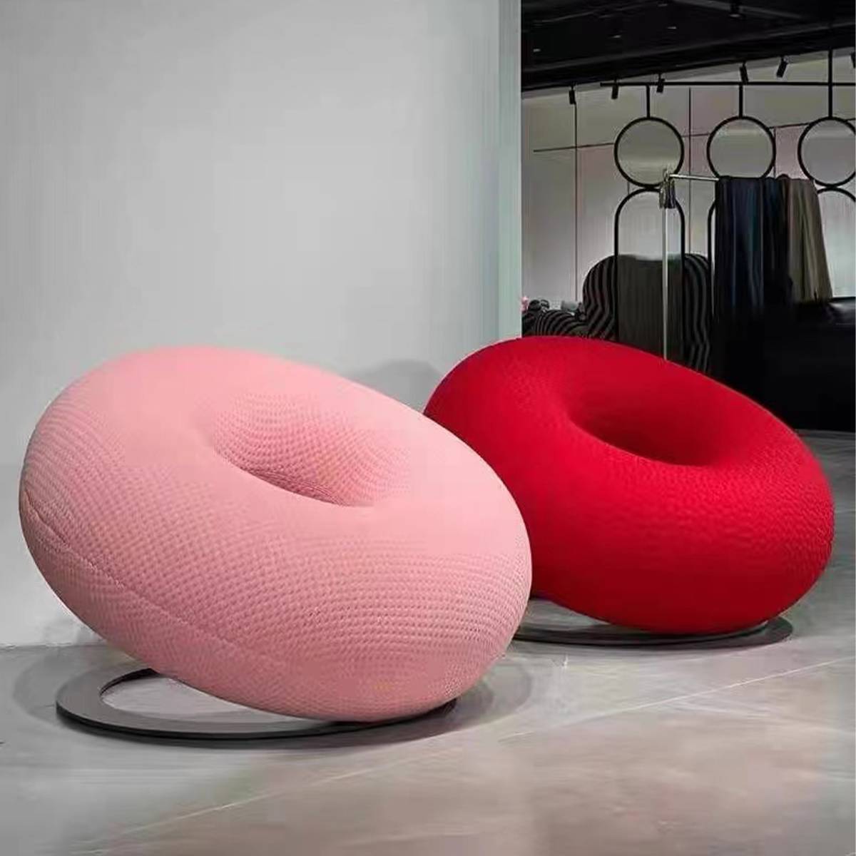 Pink and red donut leisure chairs in a showroom