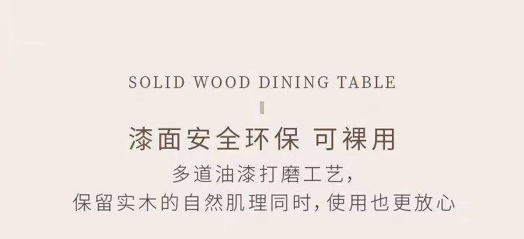 Close-up of the solid wood dining table surface with a cup and fruit bowl