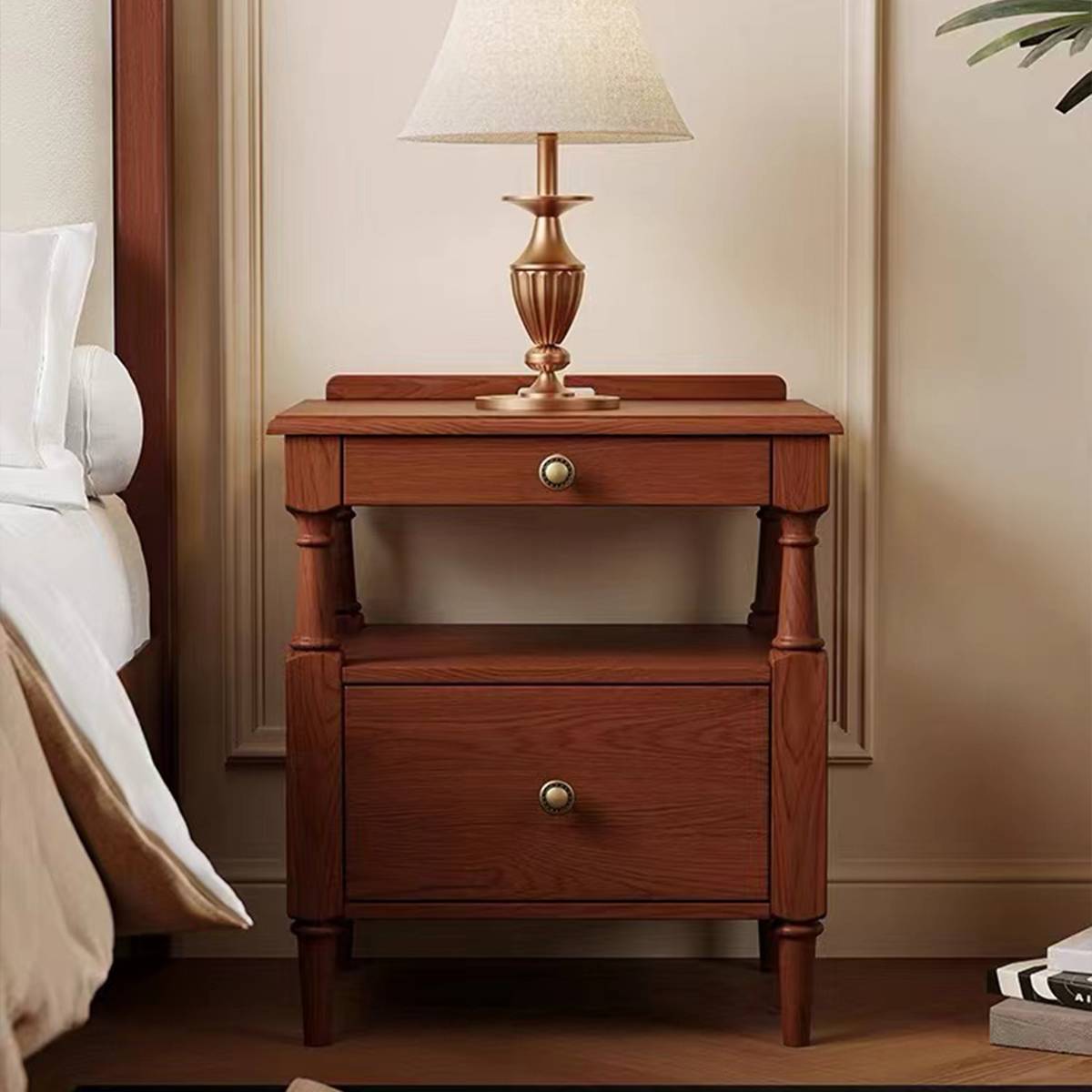 Close-up of the bedside table with drawers open showing storage