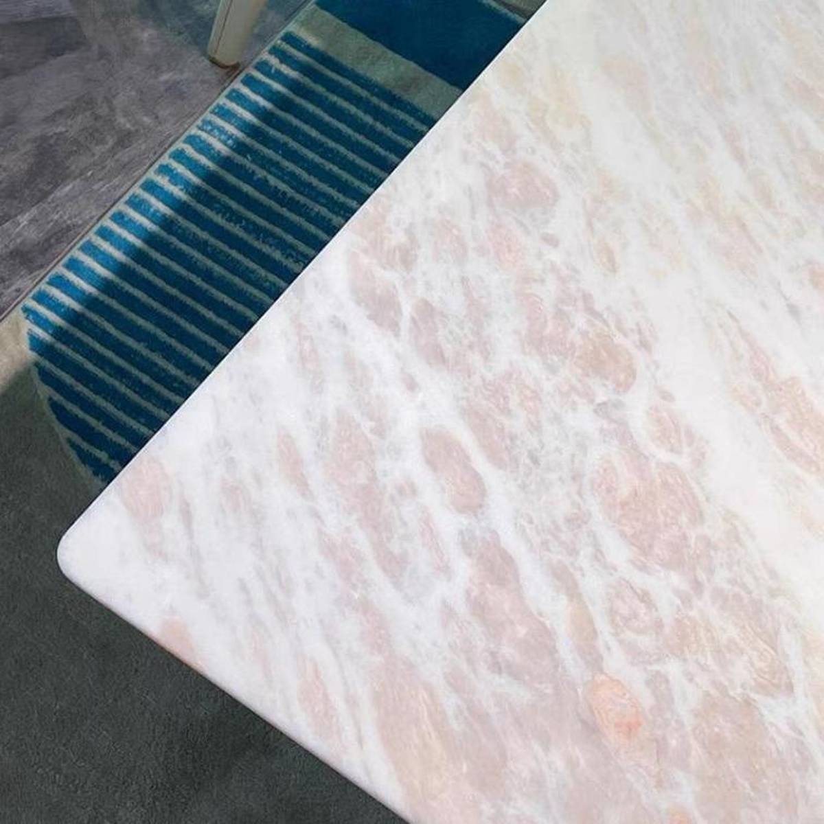 Close-up detail of the Fendi Pink marble texture and edge