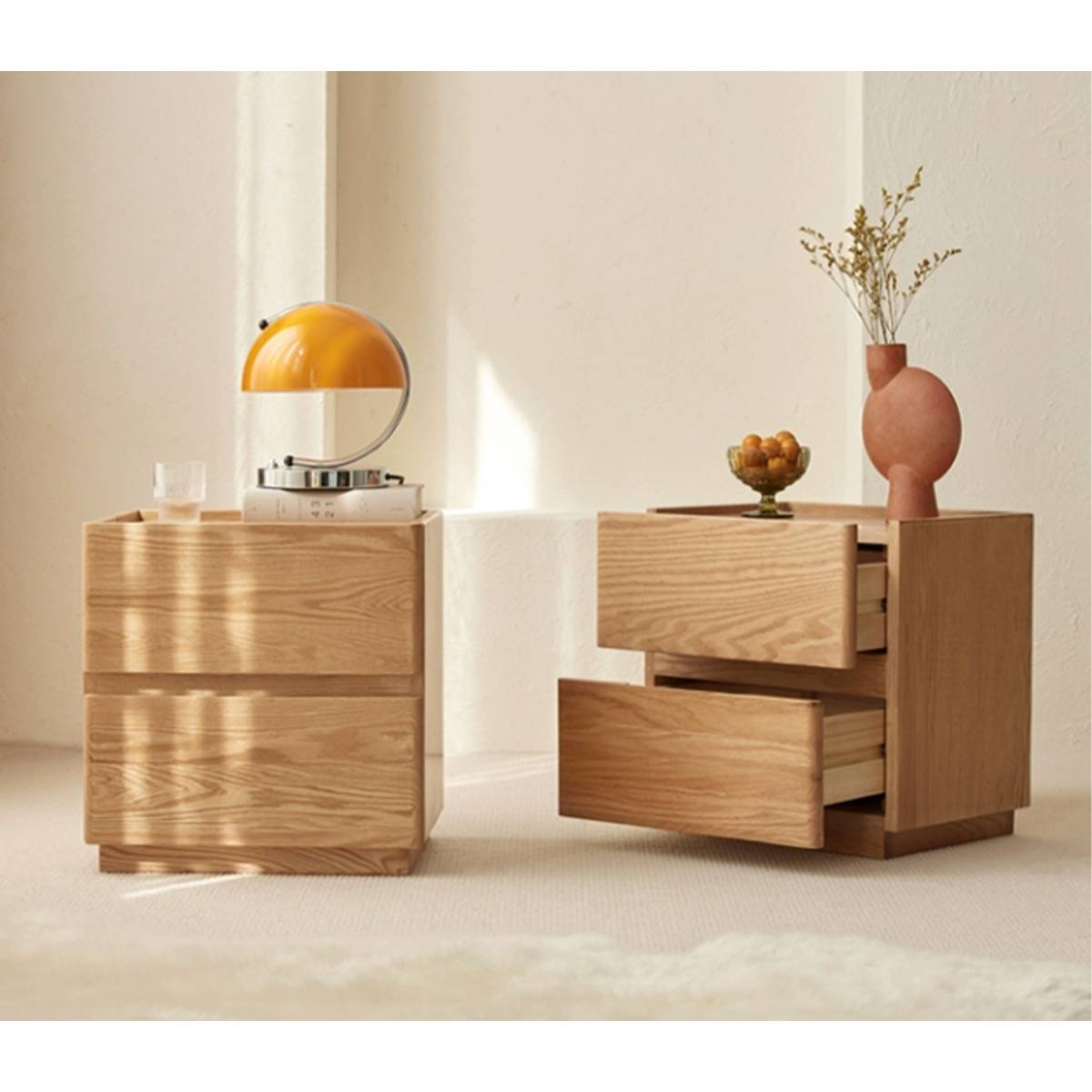 Two bedside tables side by side, one with drawers open