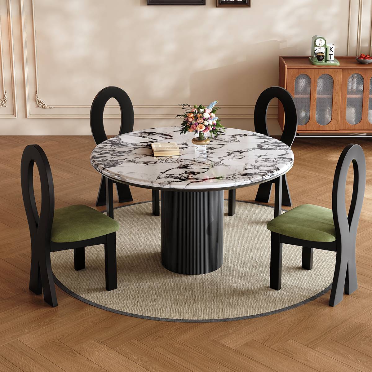 Round marble dining table with black fluted base and green velvet chairs