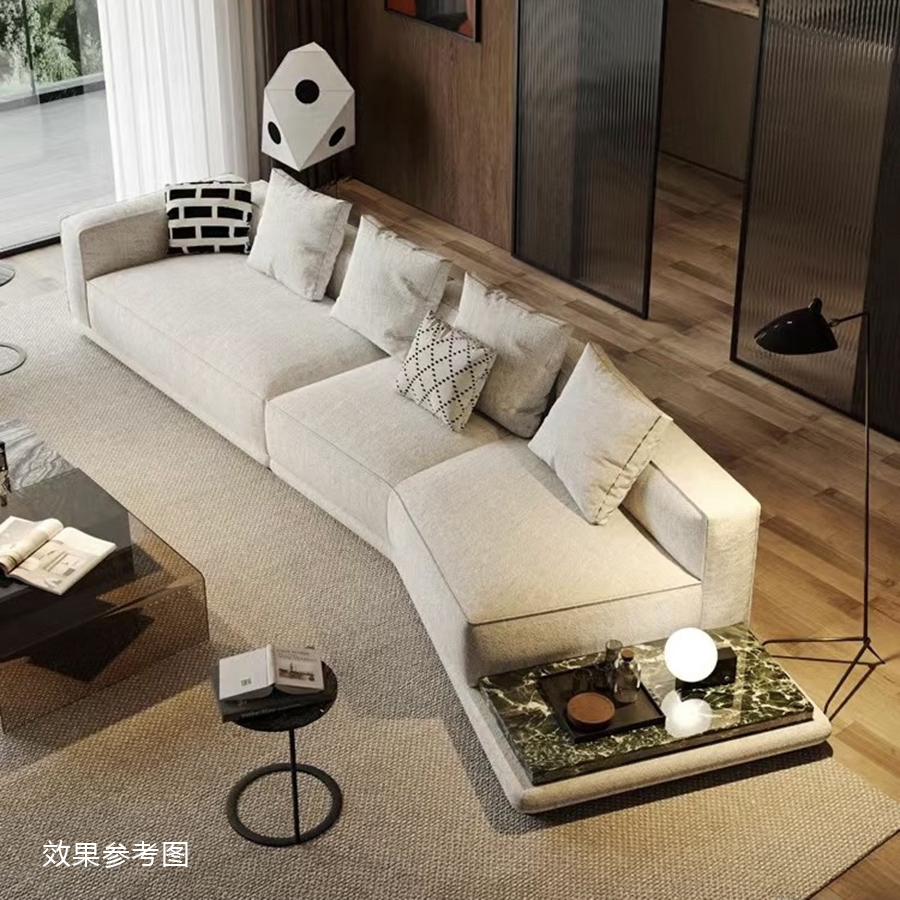 Living room setting featuring a beige modular sofa with a marble-topped side table and black floor lamp.