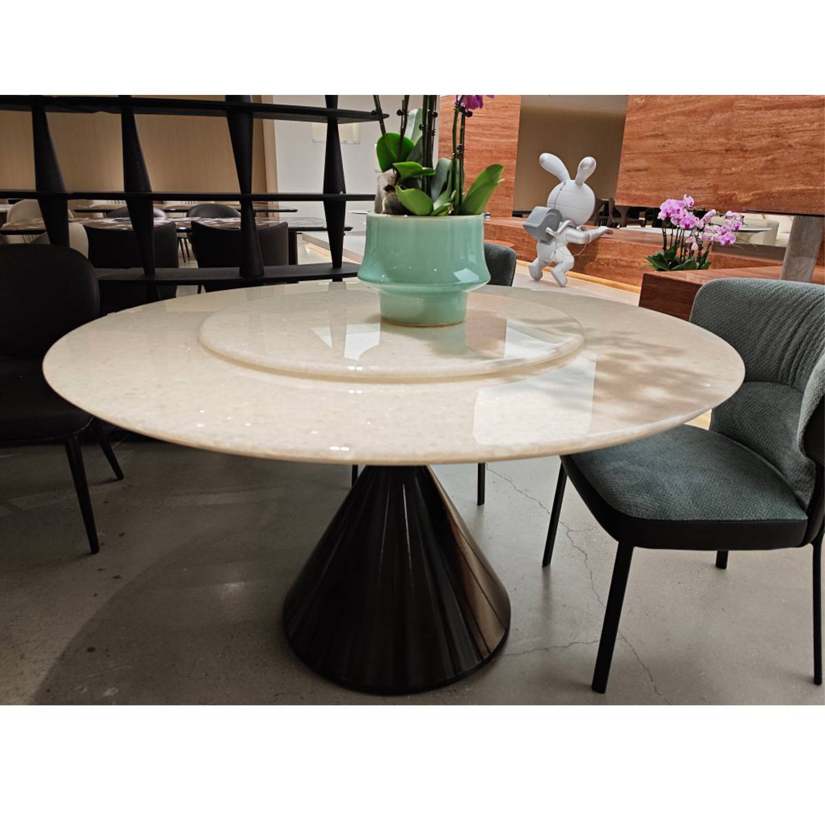 Close-up view of the natural stone tabletop and rotating tray mechanism.
