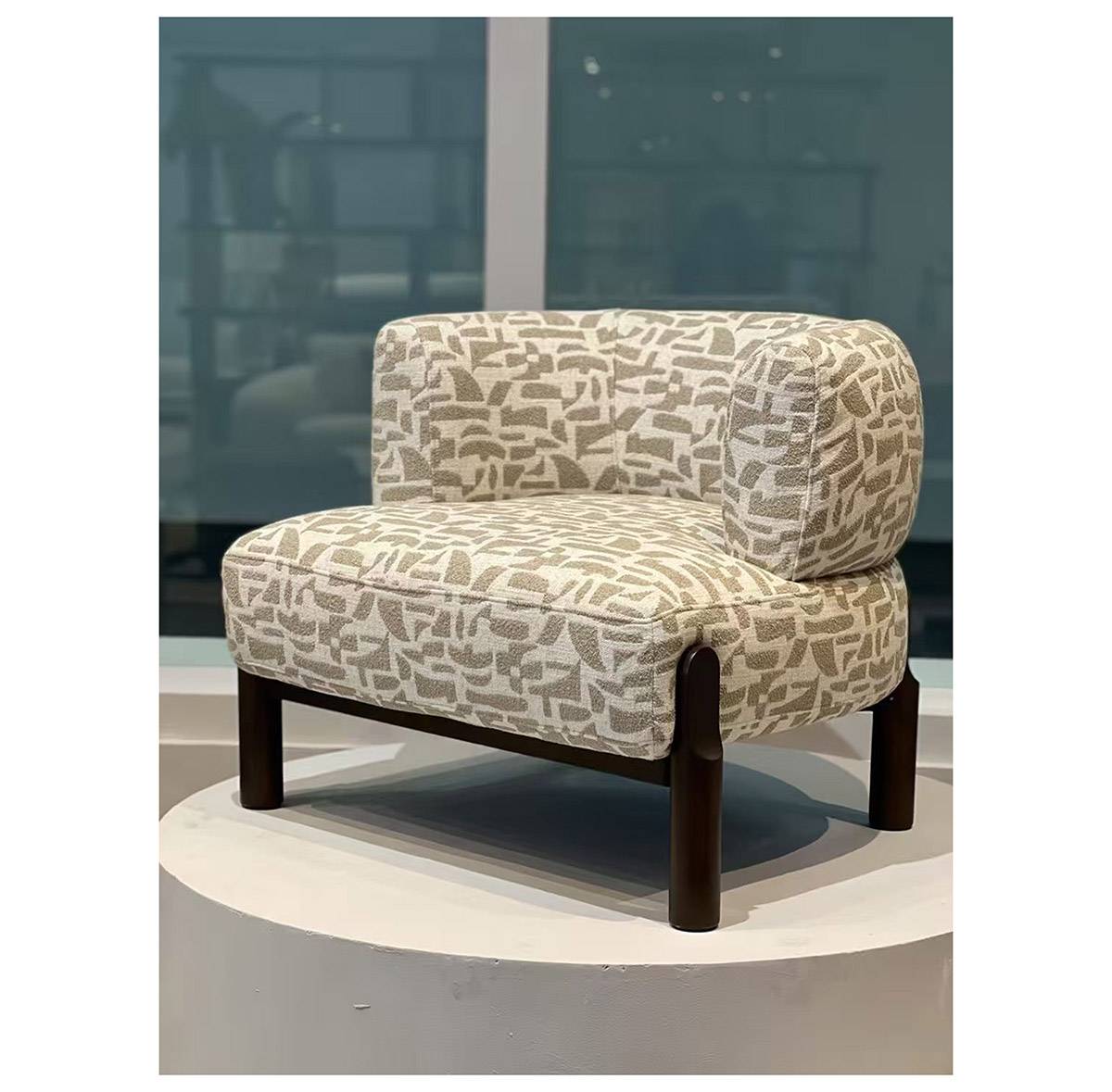 Lounge chair with patterned fabric upholstery