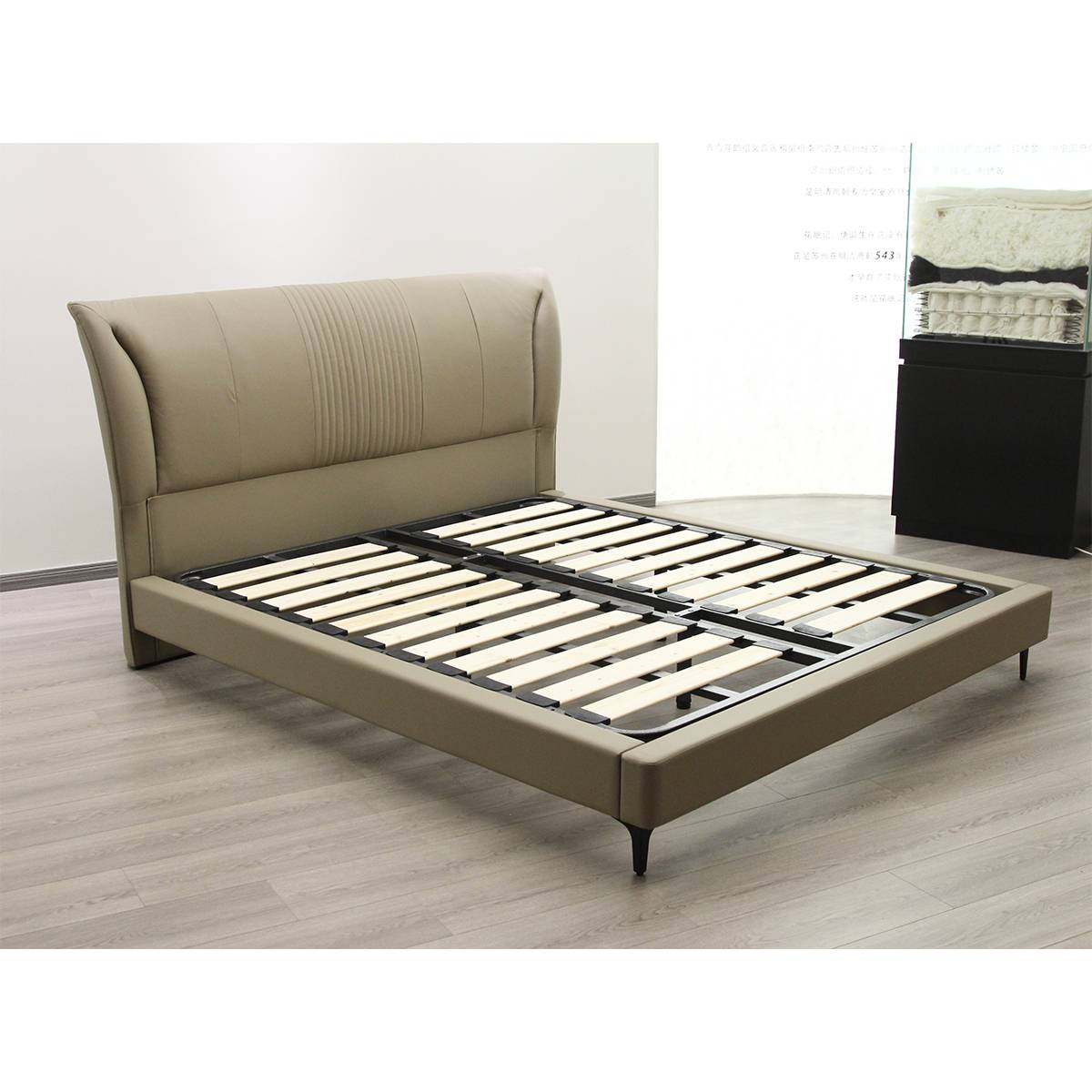 Side view of the A19 bed frame showing the wooden slat base without mattress