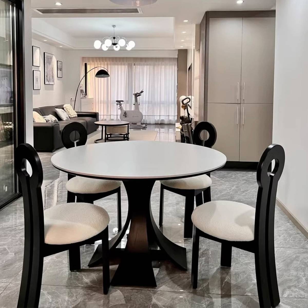 Wide shot of the dining table in a modern living and dining area.