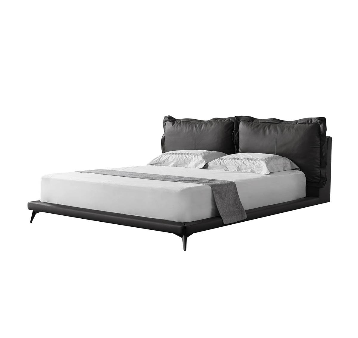 Side angle view of the black leather bed on white background
