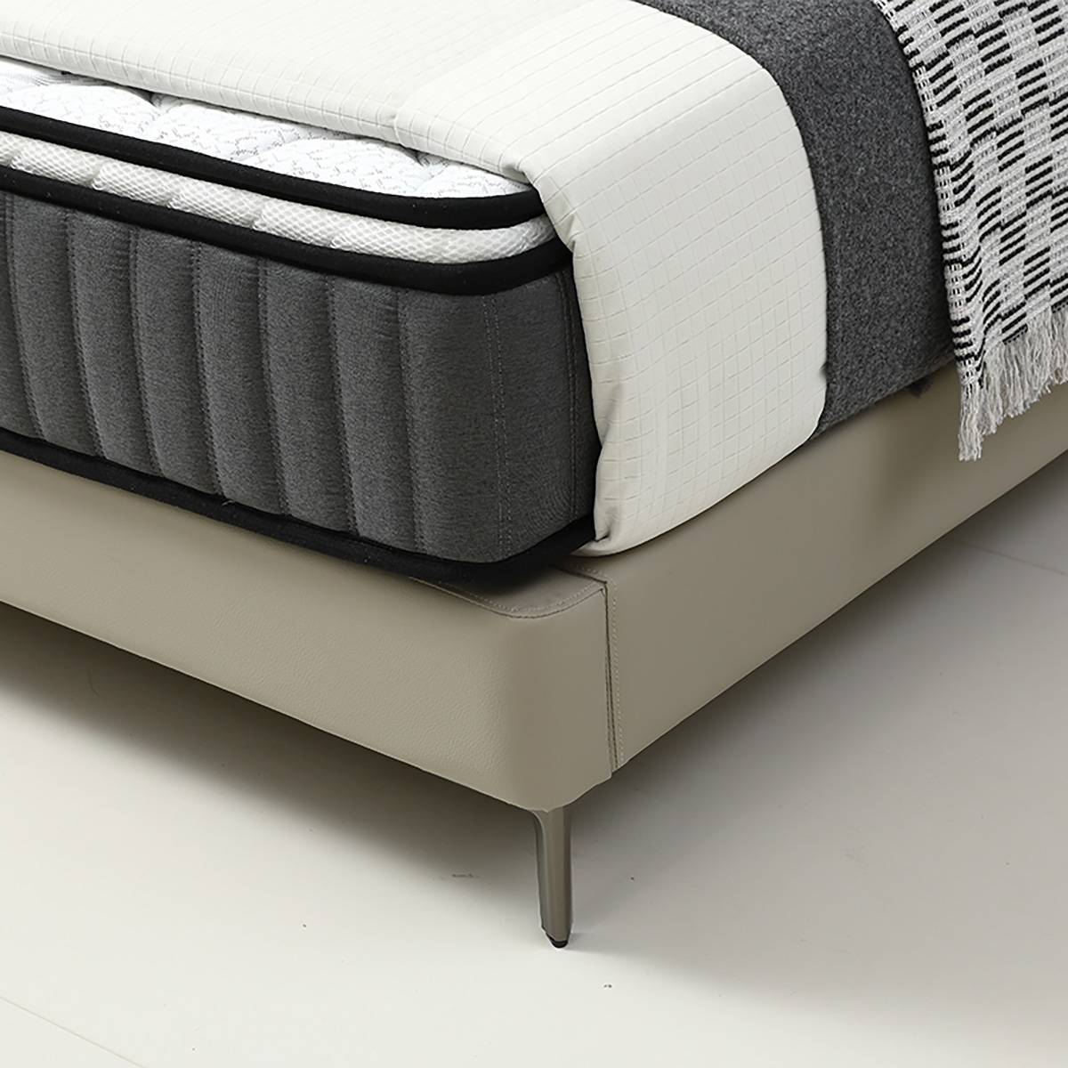 Close-up of the bed frame corner and metal leg