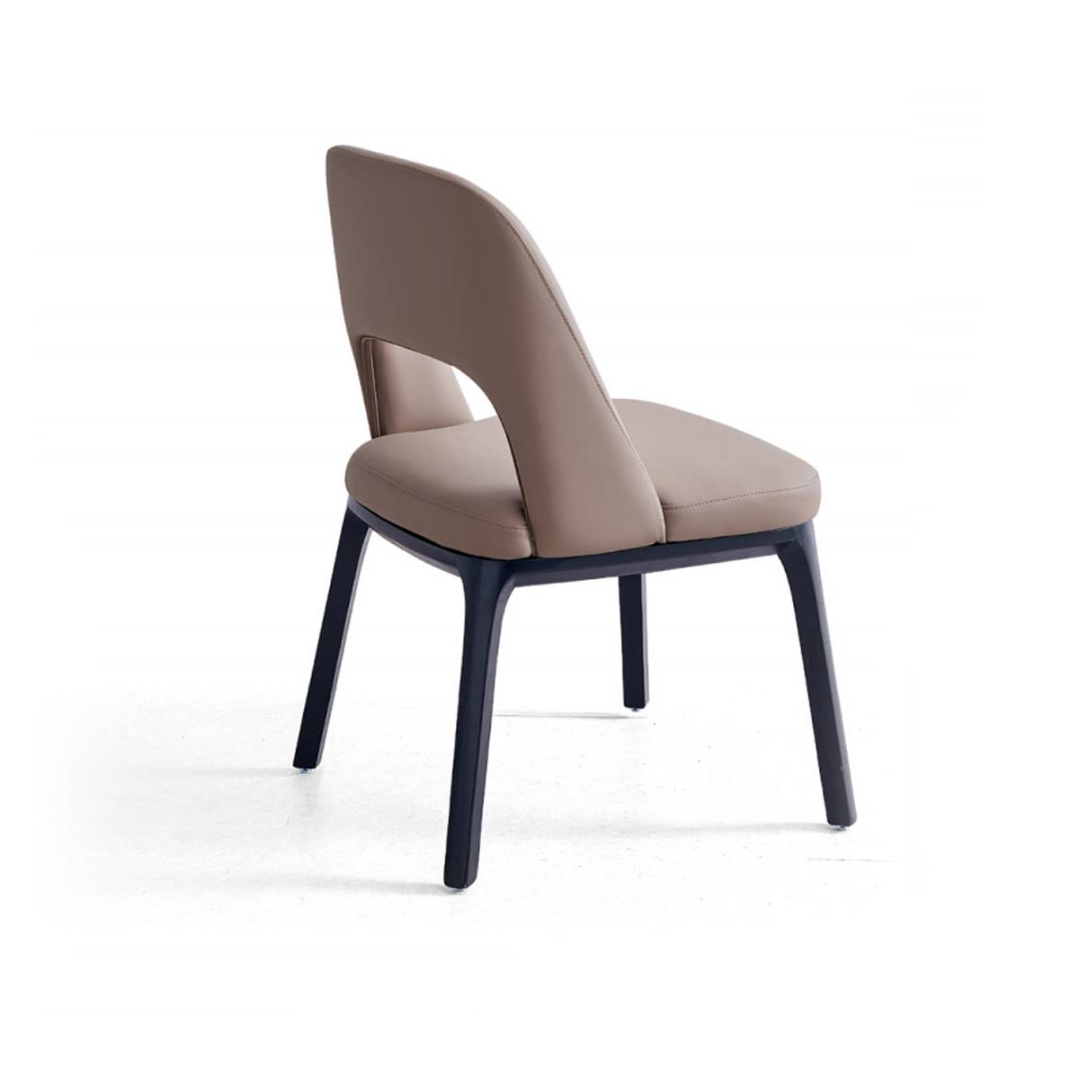 Side view of a beige upholstered dining chair with black solid wood legs
