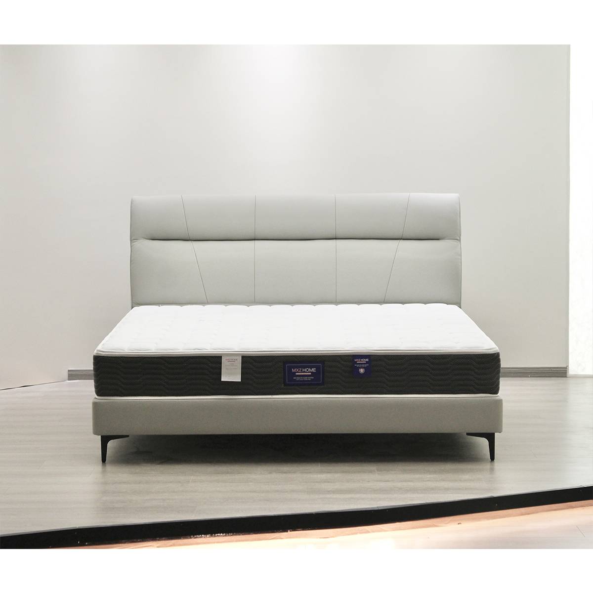 Front view of the A19 light grey leather upholstered bed