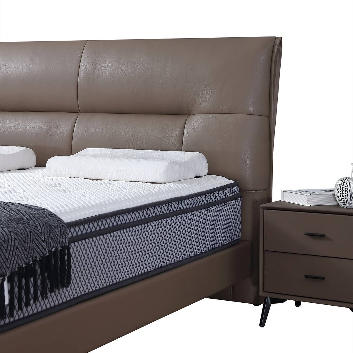 Close-up of the bed headboard and mattress detail
