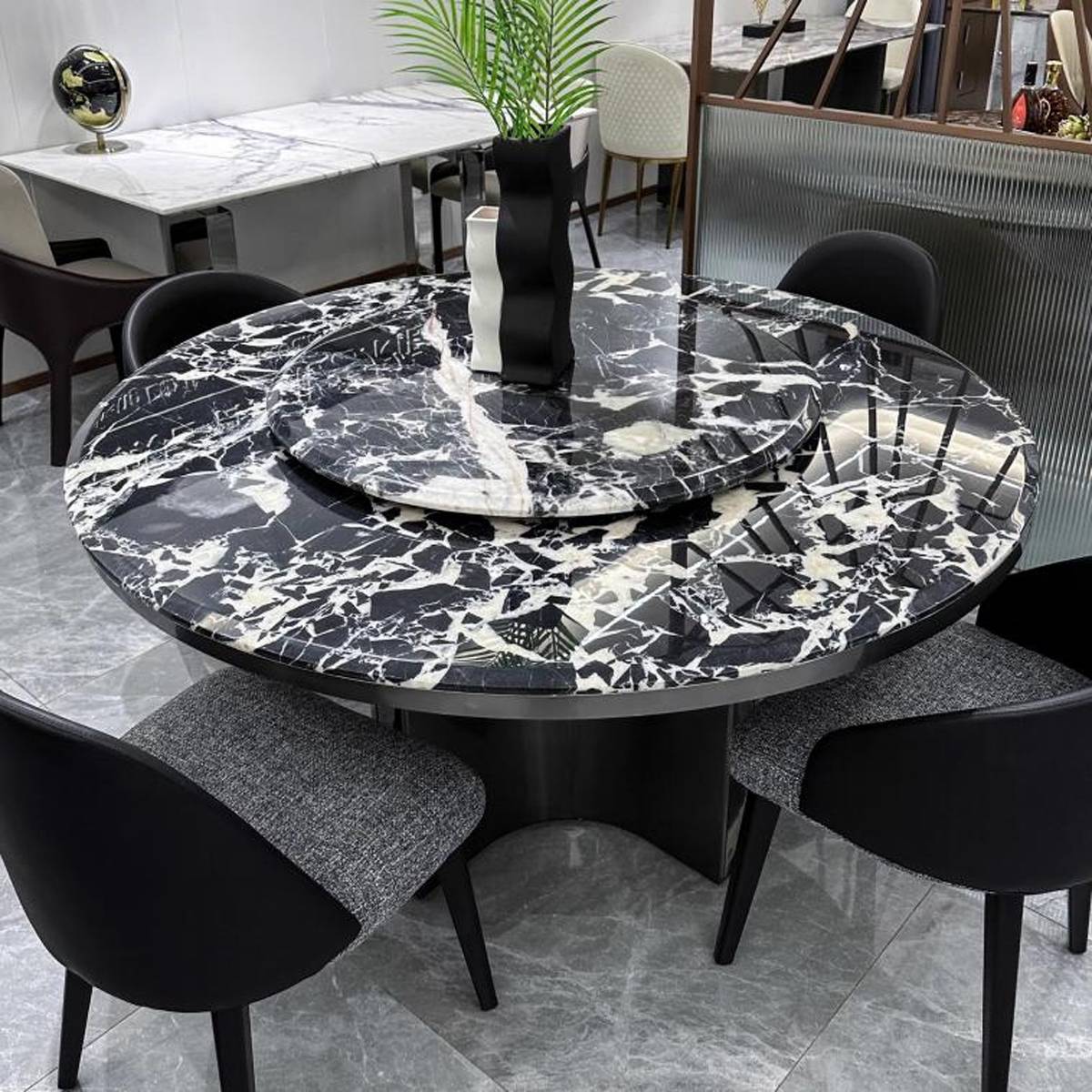 Close-up view of the Bulgari Black marble tabletop and turntable