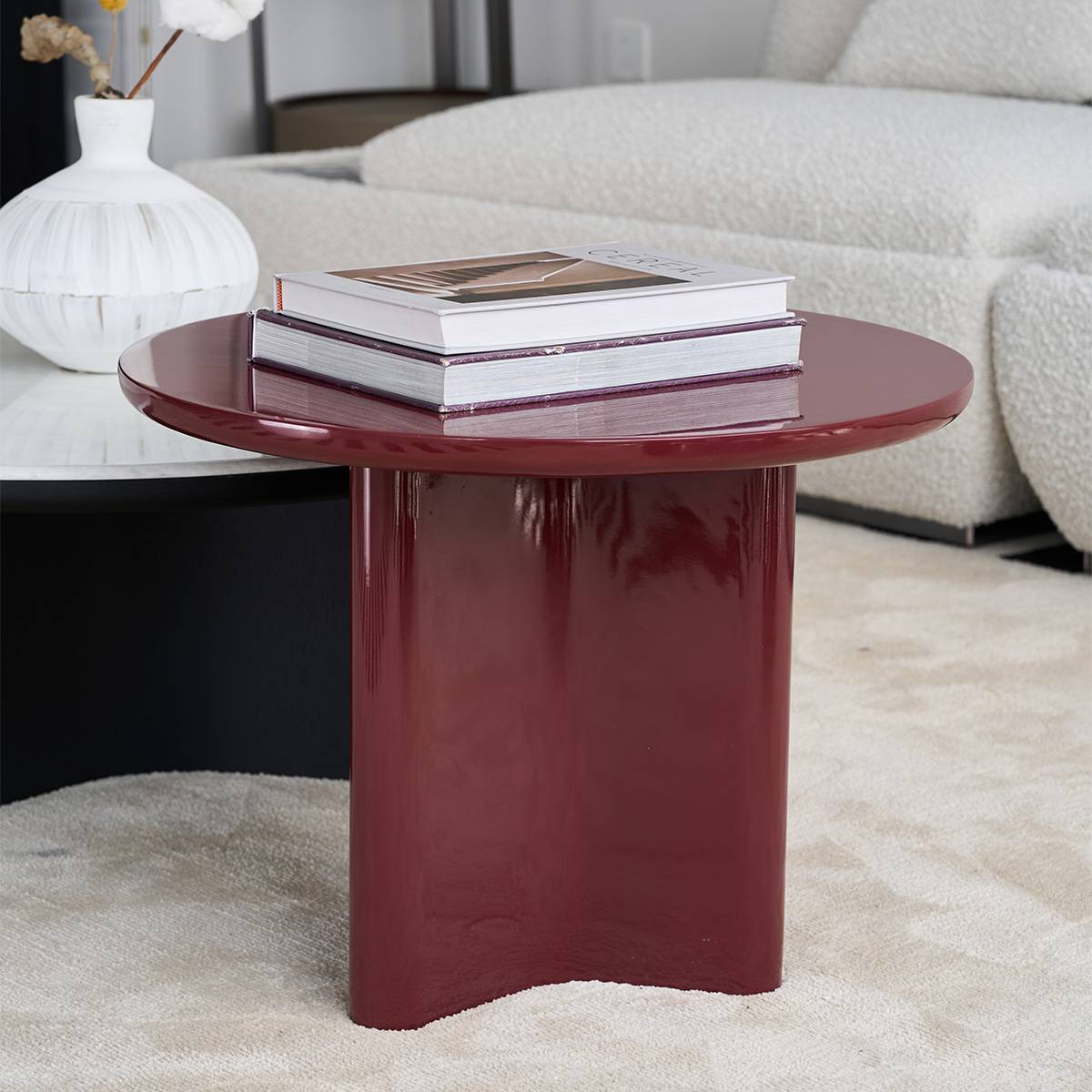 Close-up of the burgundy side table with books
