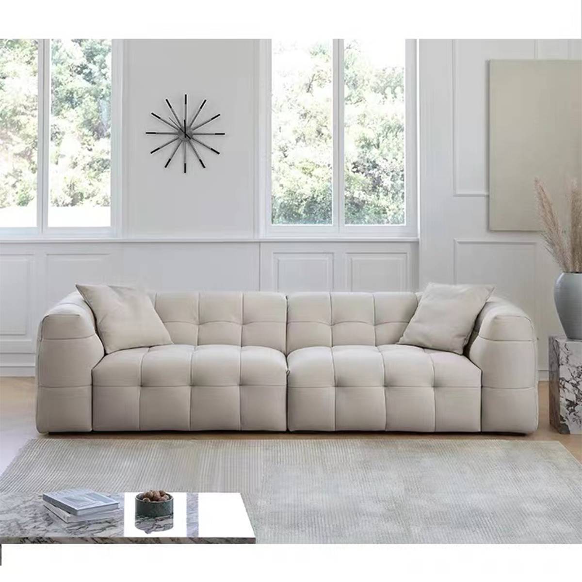 Green tufted sofa angled view showing seat cushions and backrest