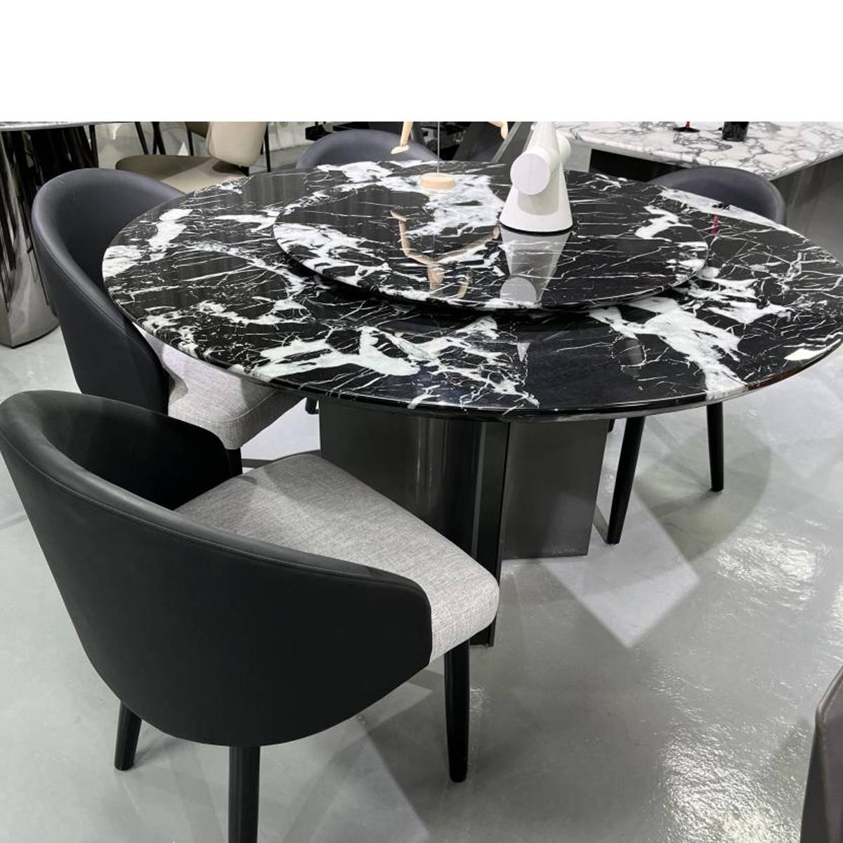Close-up view of the marble dining table surface and base