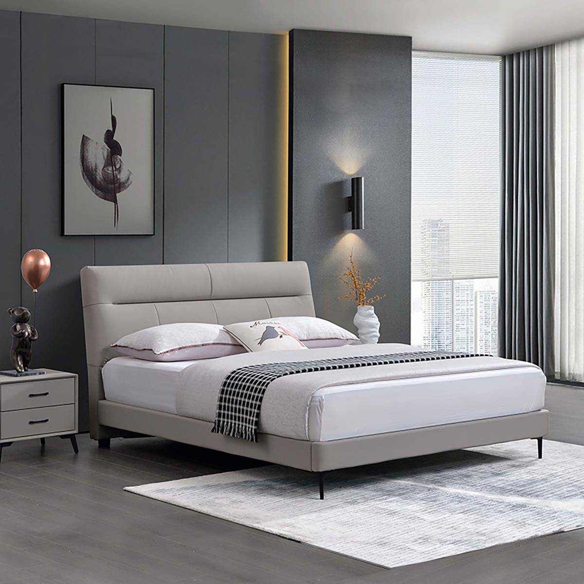Side angle view of the bed showing the headboard and nightstand