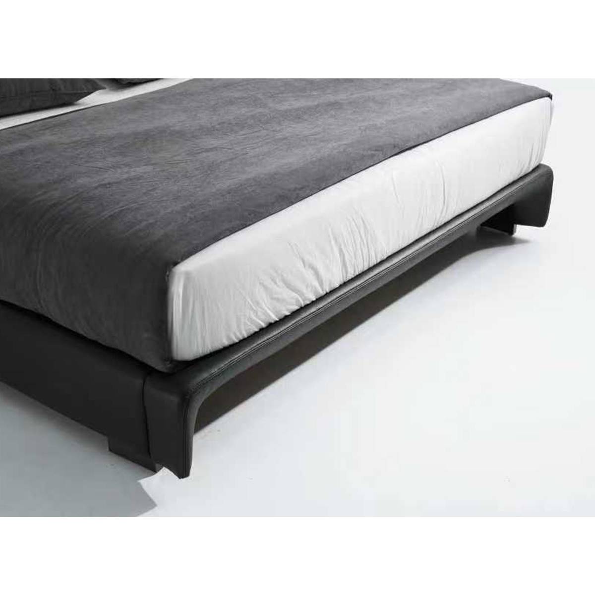 Side view showing the bed frame base and metal legs