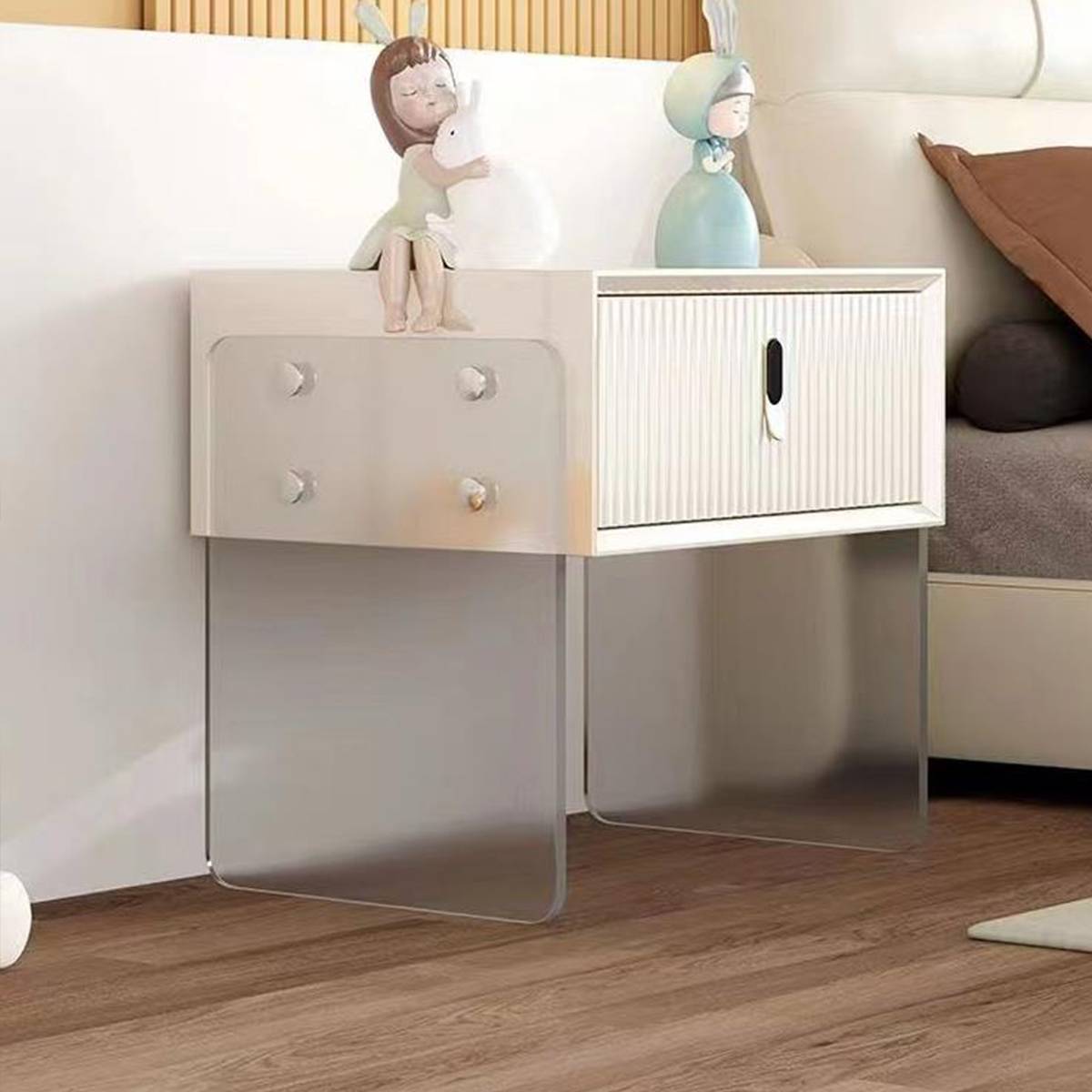Side view of the bedside cabinet showing the acrylic leg structure and drawer details