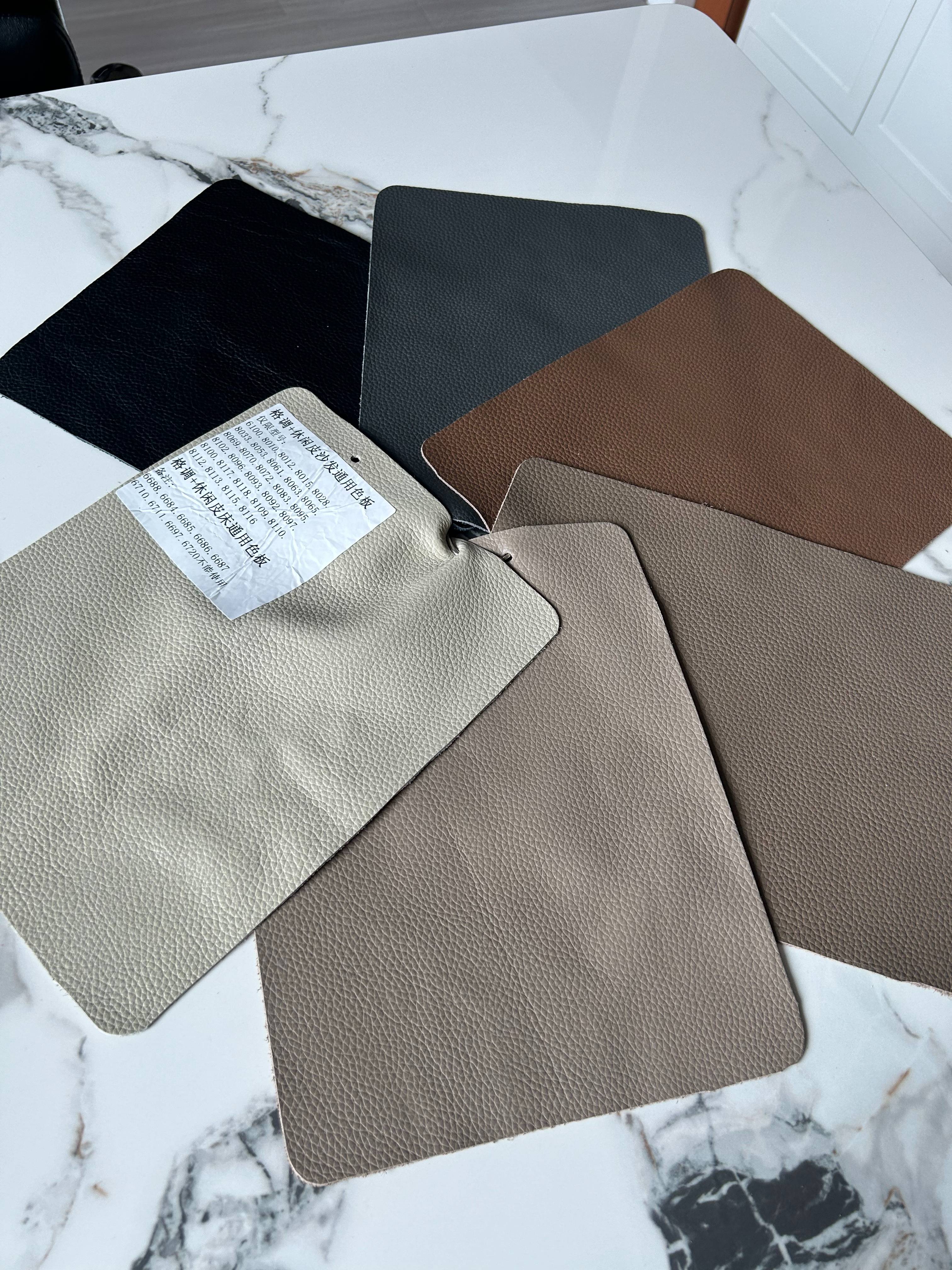 Leather color swatches showing black, dark grey, brown, and beige options