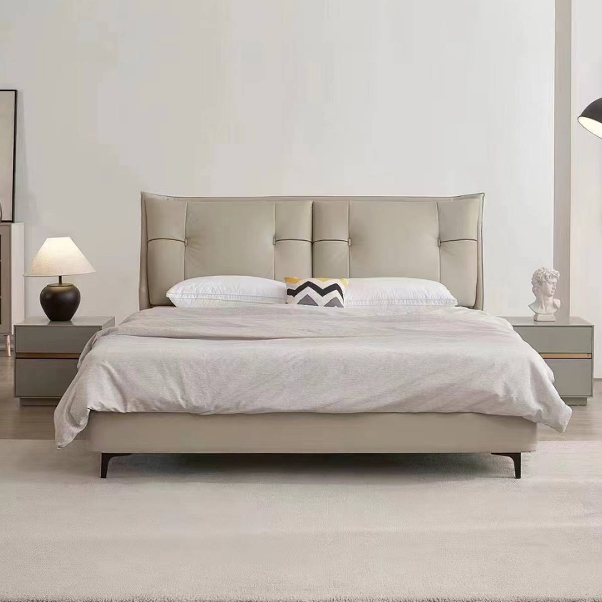 Front view of the A19 leather bed showing the headboard details and bedding