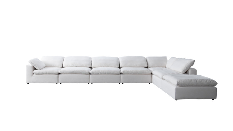 Side view of white fabric sofa with chaise