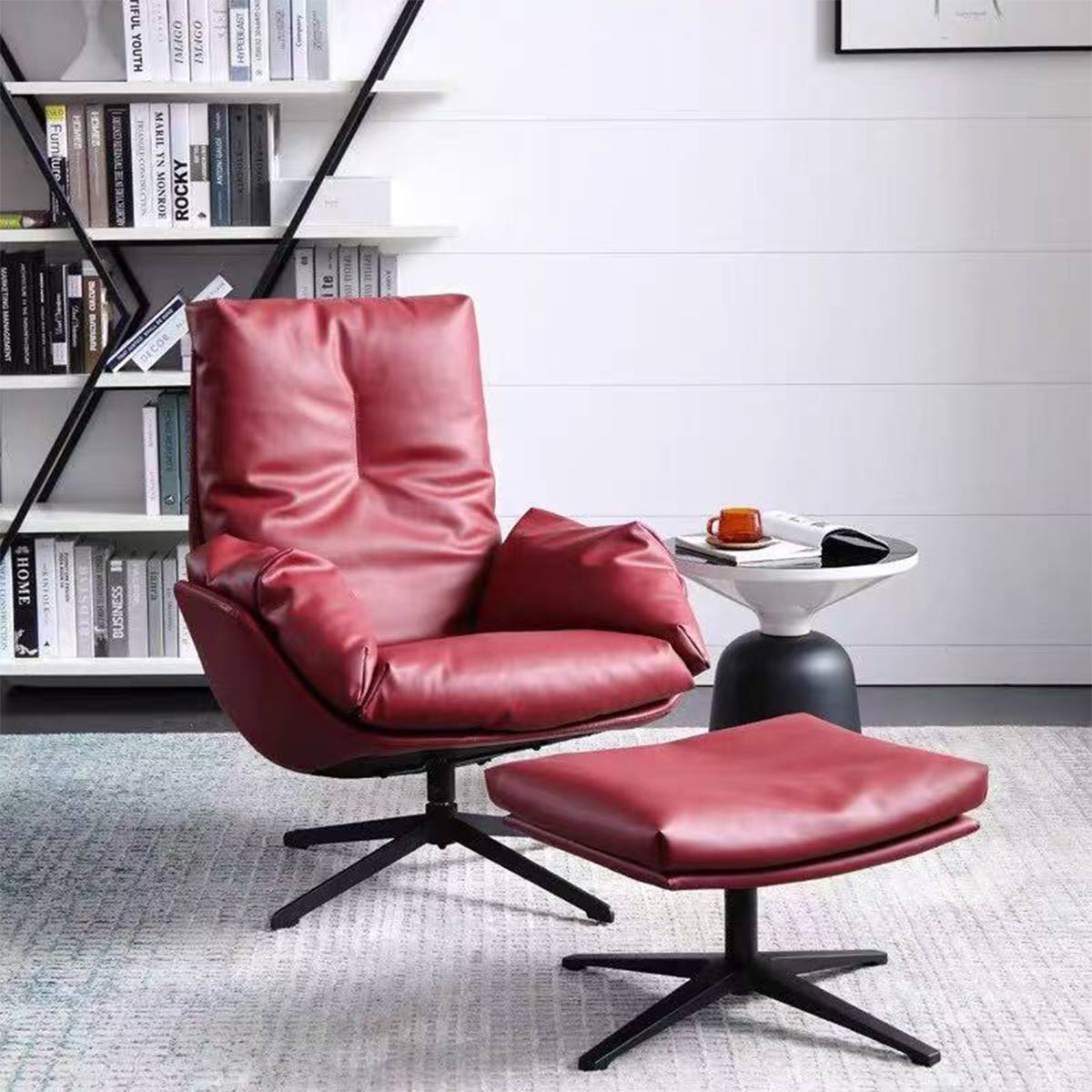 Front view of red leather leisure chair and ottoman near a bookshelf
